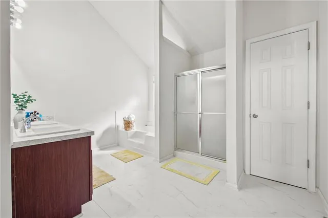 a bathroom with a tub and shower