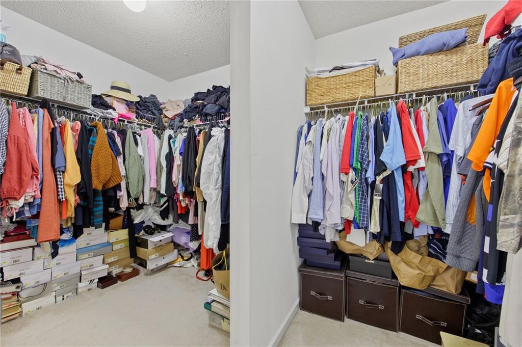 407 Grier Drive Locust Grove, GA 30248 - Photo 29 of 38 a view of walk in closet with clothes