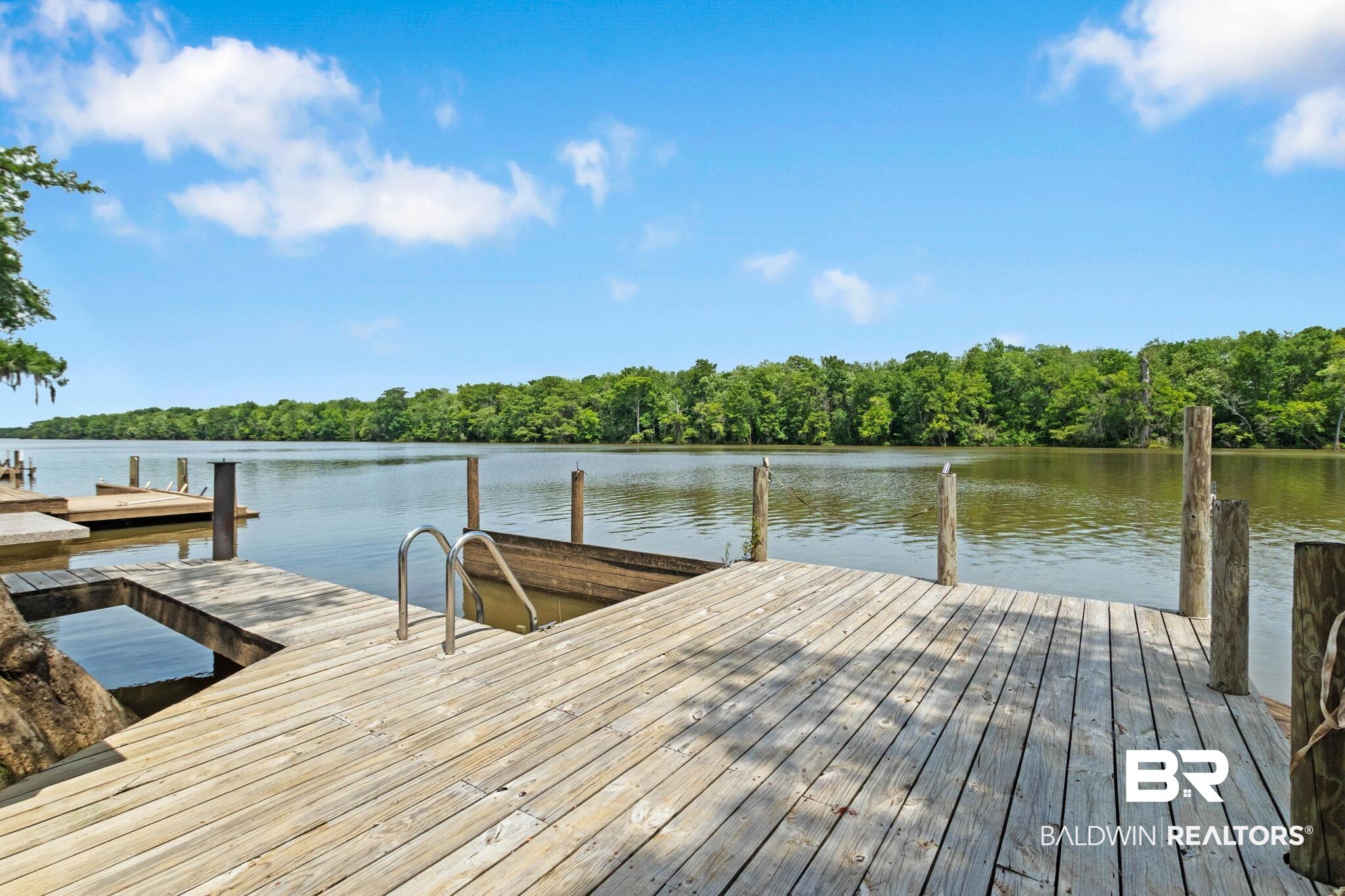 8153 Bryant's Lndg Road Stockton, AL 36579 - Photo 73 of 87 Wood dock with integrated boat slip, stainless steel ladder, and water frontage