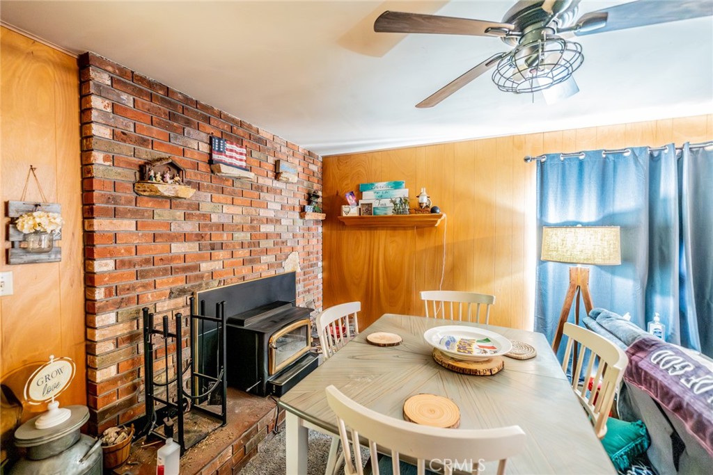 52647 Pine Cove Road Idyllwild, CA 92549 - Photo 13 of 35 a view of a dining room with furniture and wooden floor