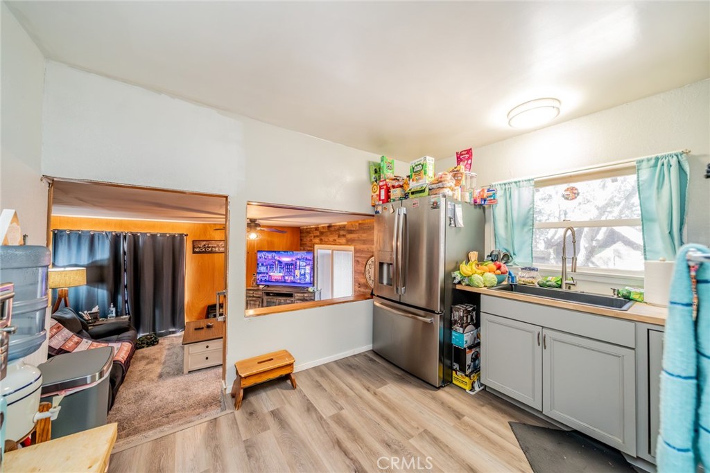 52647 Pine Cove Road Idyllwild, CA 92549 - Photo 17 of 35 a room with wooden floor and furniture