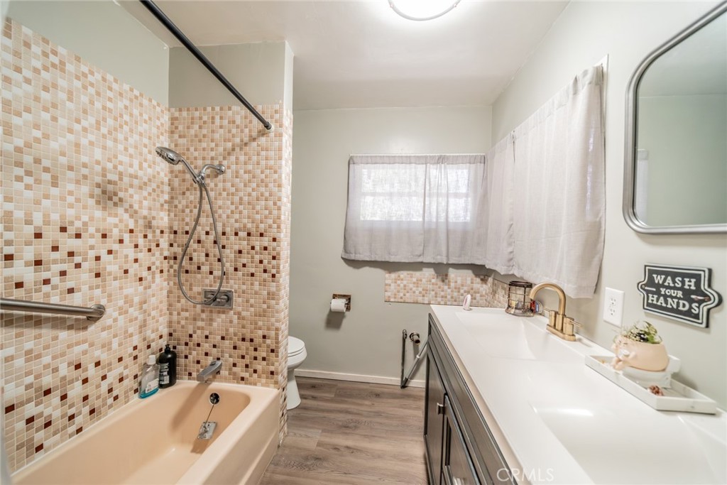52647 Pine Cove Road Idyllwild, CA 92549 - Photo 4 of 35 a bathroom with a sink a bathtub and a mirror