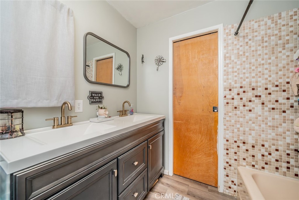 52647 Pine Cove Road Idyllwild, CA 92549 - Photo 5 of 35 a bathroom with a sink a mirror and a shower
