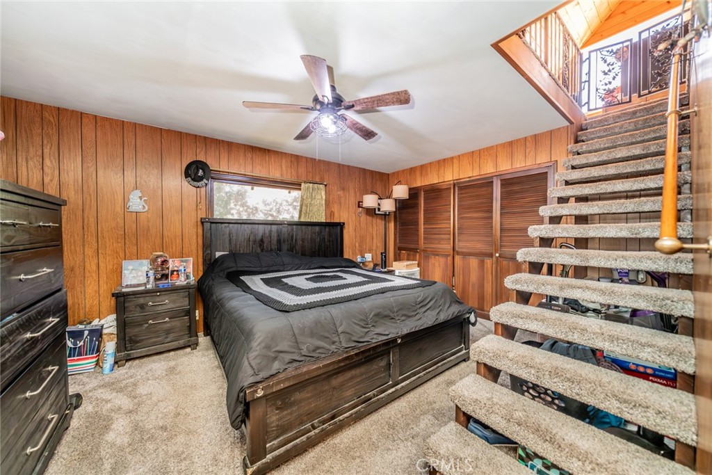 52647 Pine Cove Road Idyllwild, CA 92549 - Photo 6 of 35 a bedroom with a bed and a flat tv screen