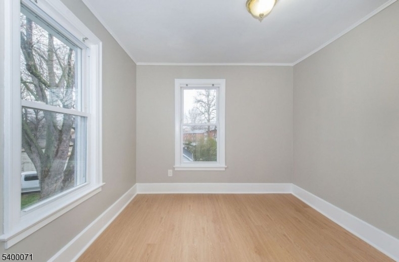 25 Henry Street, Unit 2 Bloomfield, NJ 07003 - Photo 6 of 7 a view of a room that has a window in it