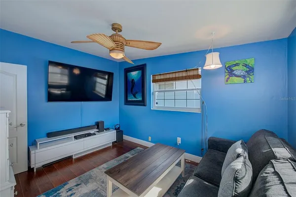 a bedroom with furniture and flat screen tv