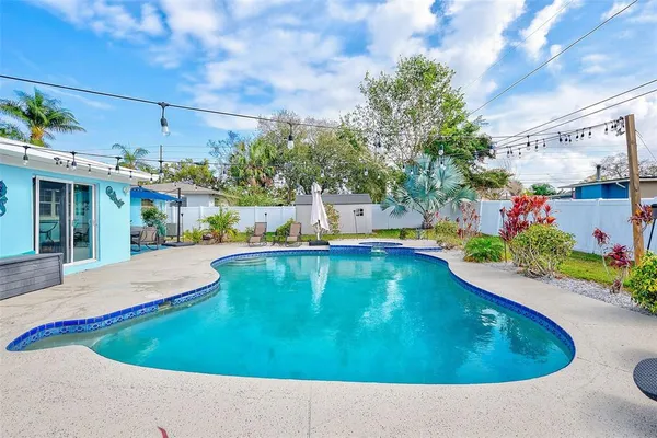 a view of swimming pool with a patio