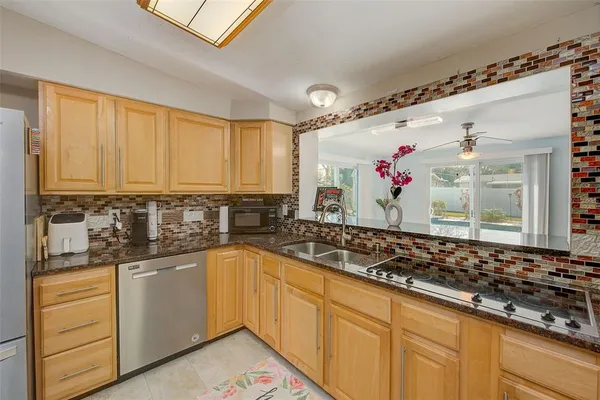 a kitchen with sink cabinets and stove