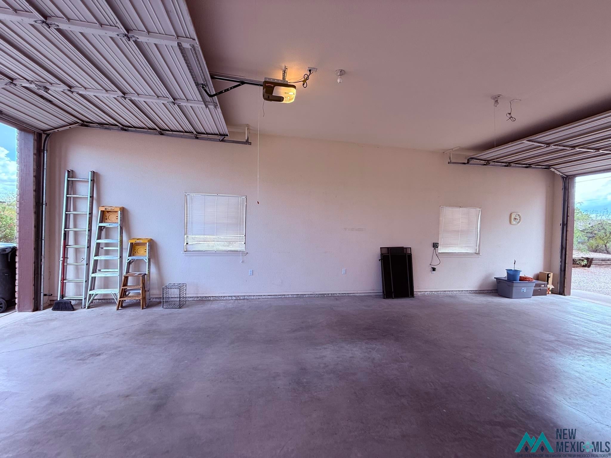 300 Rio Grande Circle Elephant Butte, NM 87935 - Photo 72 of 99 Spacious garage featuring concrete flooring and light-toned walls