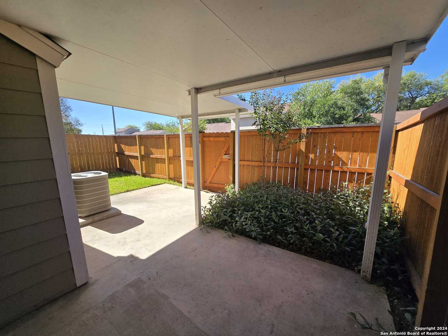 9140 Timber Path, Unit 2702 San Antonio, TX 78250 - Photo 19 of 22 a view of a backyard