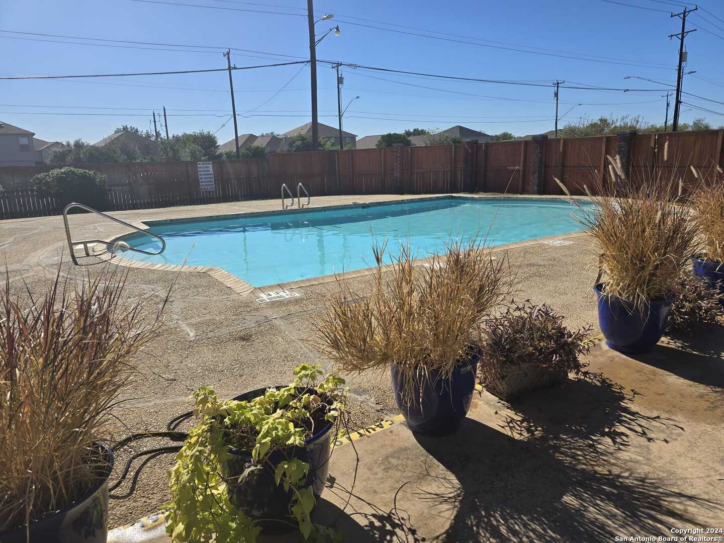 9140 Timber Path, Unit 2702 San Antonio, TX 78250 - Photo 22 of 22 a view of a backyard of the house