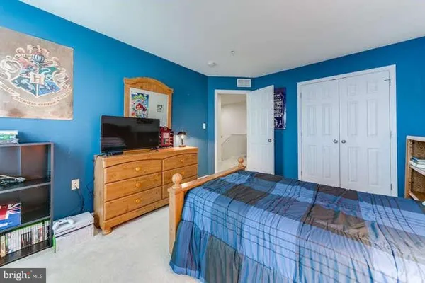 a bedroom with a bed and furniture