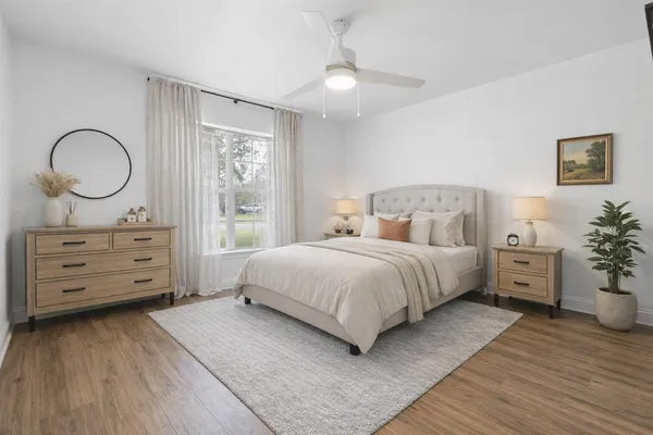 a bedroom with a bed and a dresser