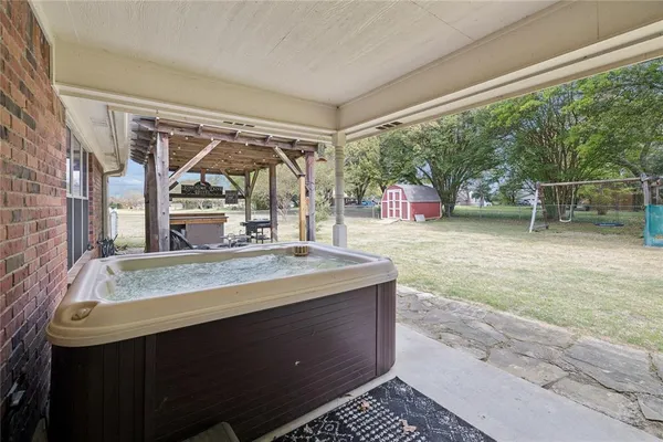 a room with a large window and a sink