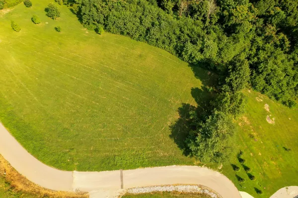 a view of a field with an ocean