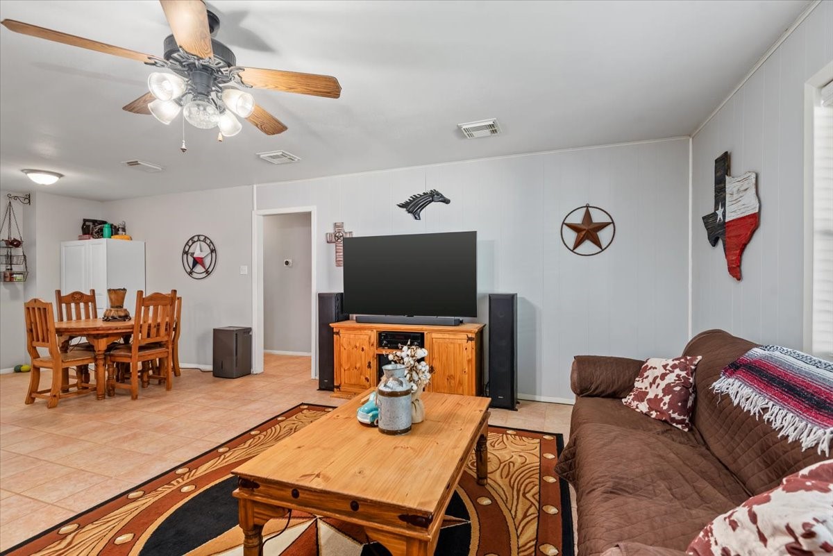 1651 Fultz Court Conroe, TX 77304 - Photo 11 of 38 a living room with furniture and a flat screen tv