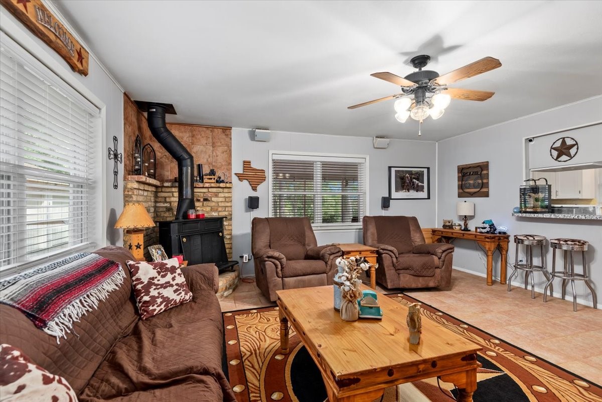 1651 Fultz Court Conroe, TX 77304 - Photo 13 of 38 a living room with furniture ceiling fan and a window