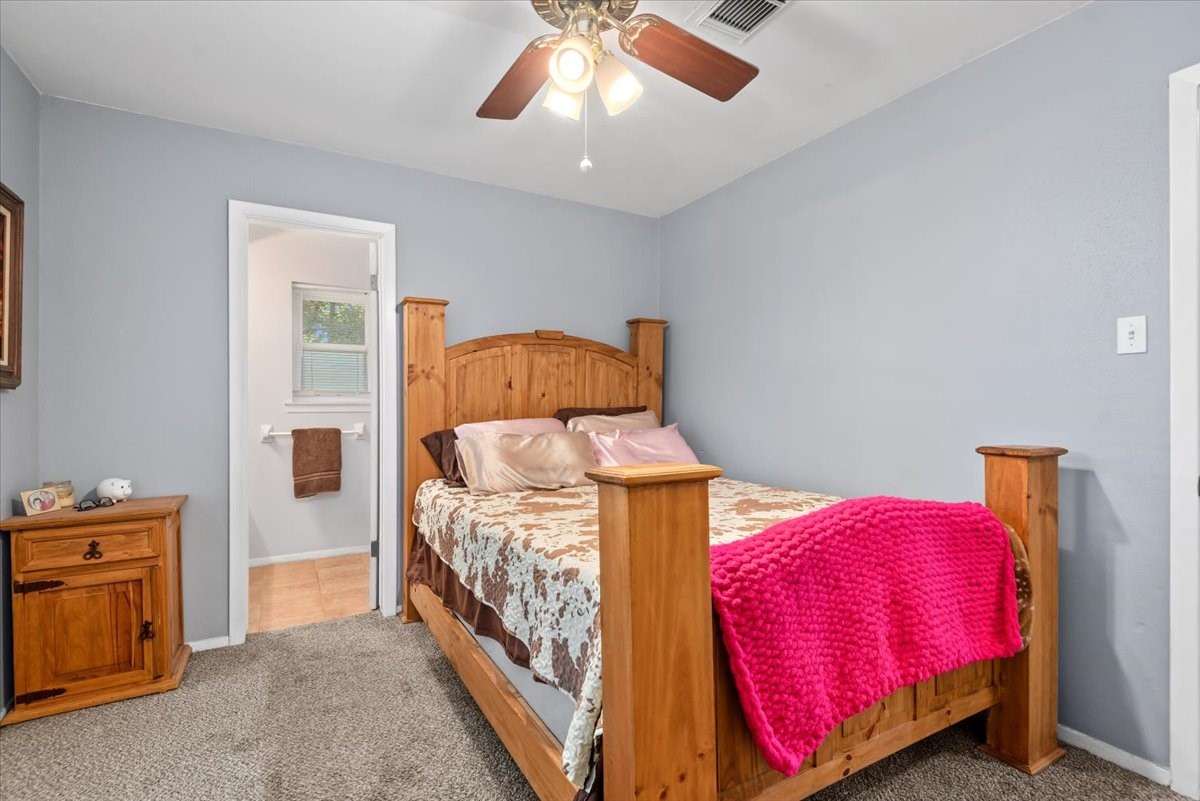 1651 Fultz Court Conroe, TX 77304 - Photo 23 of 38 a bedroom with a bed and a closet