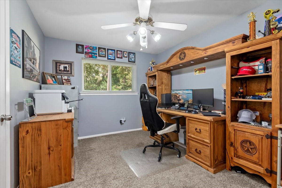 1651 Fultz Court Conroe, TX 77304 - Photo 27 of 38 a view of a workspace with furniture and a window