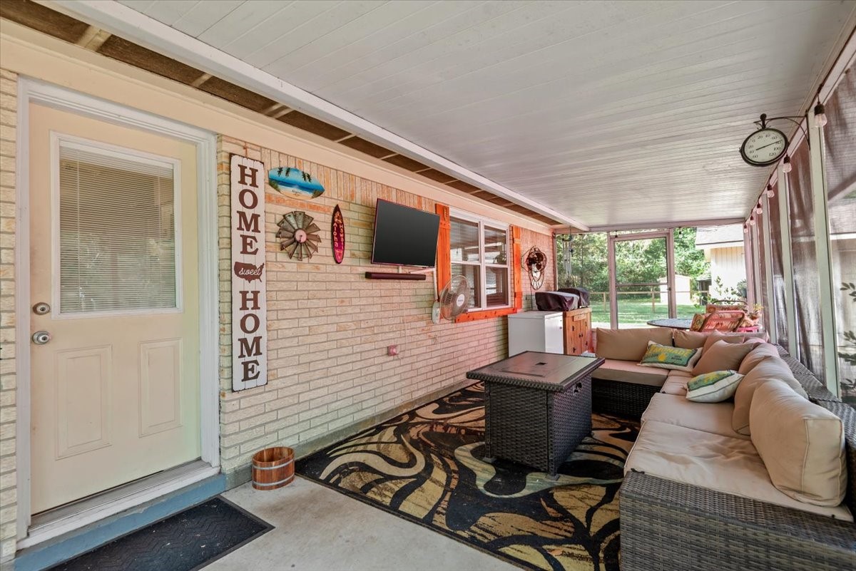 1651 Fultz Court Conroe, TX 77304 - Photo 29 of 38 a living room with furniture and a window