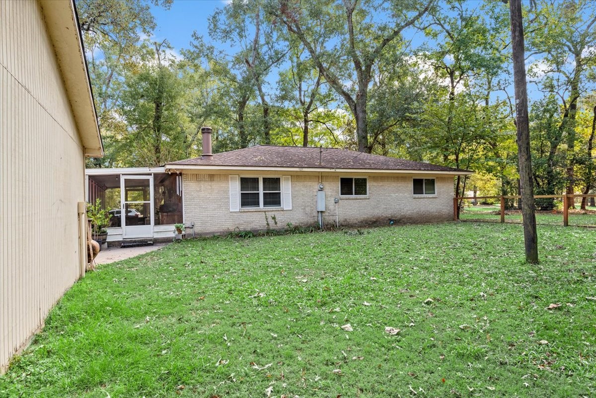 1651 Fultz Court Conroe, TX 77304 - Photo 31 of 38 front view of a house with a yard