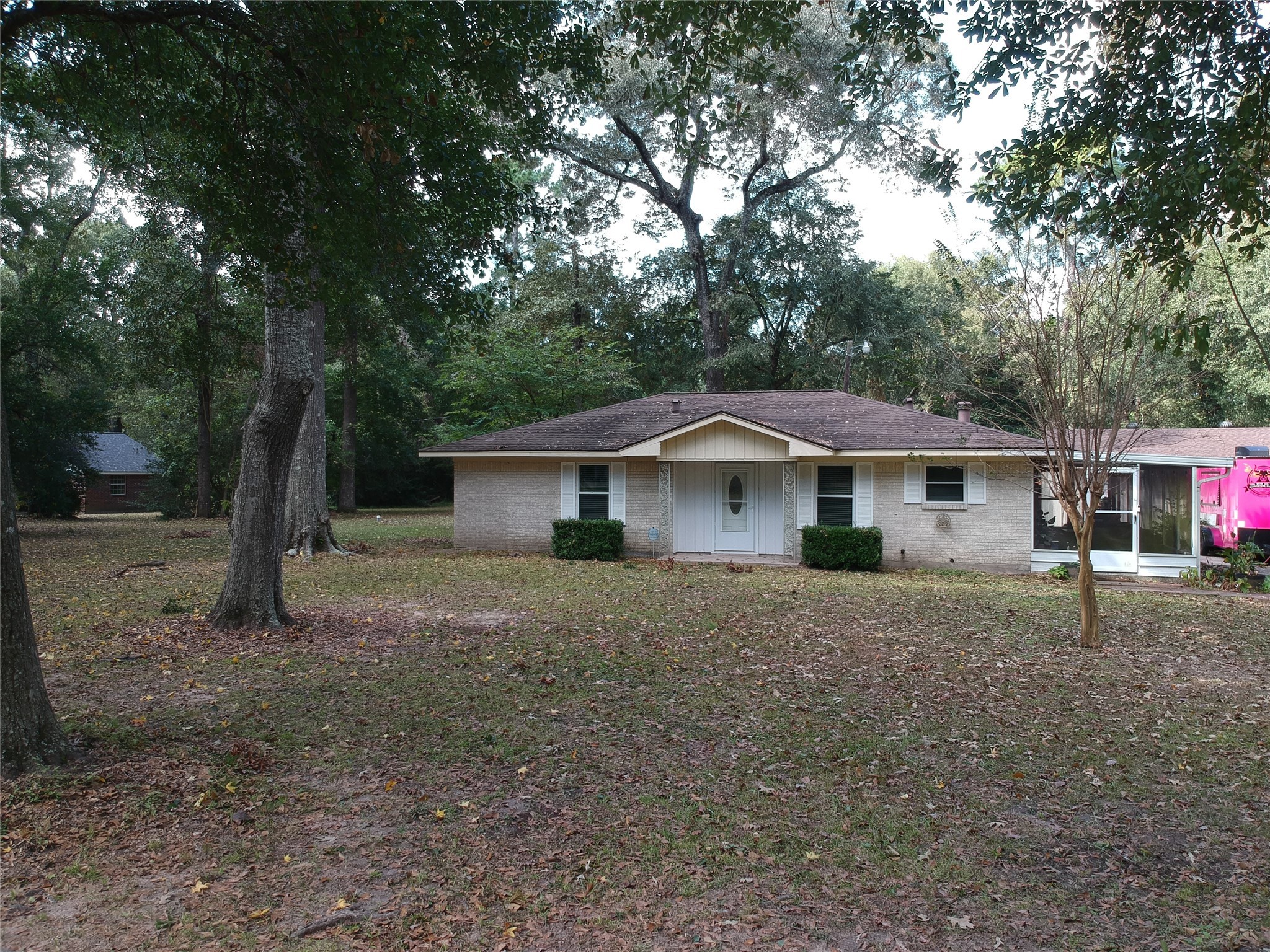 1651 Fultz Court Conroe, TX 77304 - Photo 36 of 38 a view of a house with a yard
