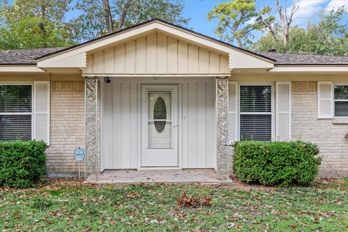 1651 Fultz Court Conroe, TX 77304 - Photo 5 of 38 a view of a small house with yard