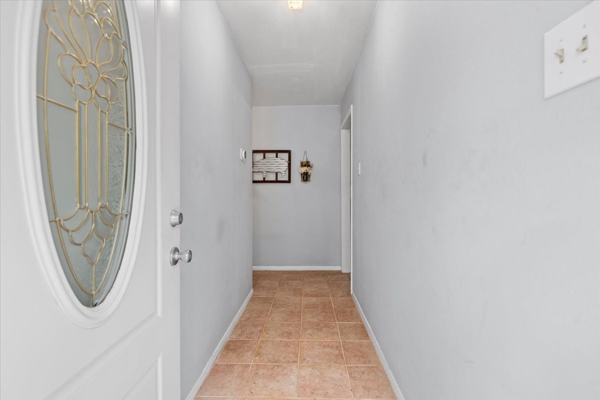 1651 Fultz Court Conroe, TX 77304 - Photo 7 of 38 a view of a hallway with wooden floor