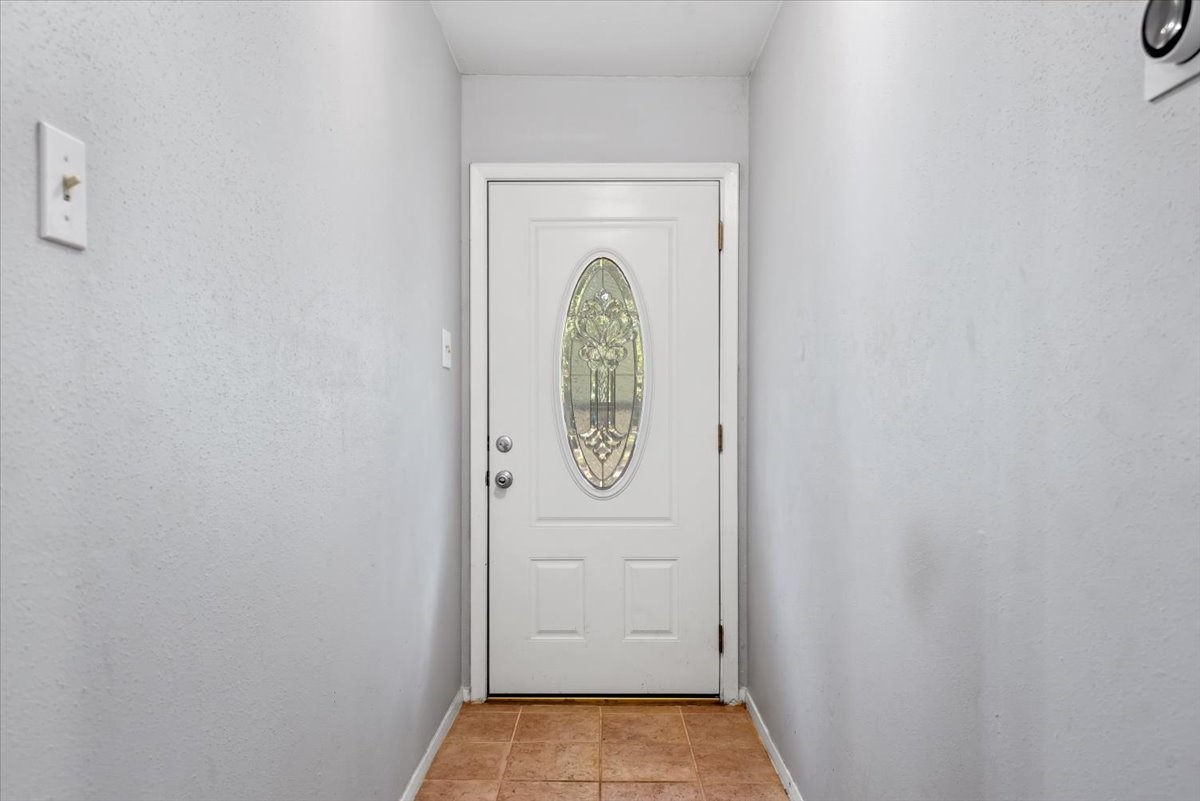 1651 Fultz Court Conroe, TX 77304 - Photo 8 of 38 a view of a door and a window in the house