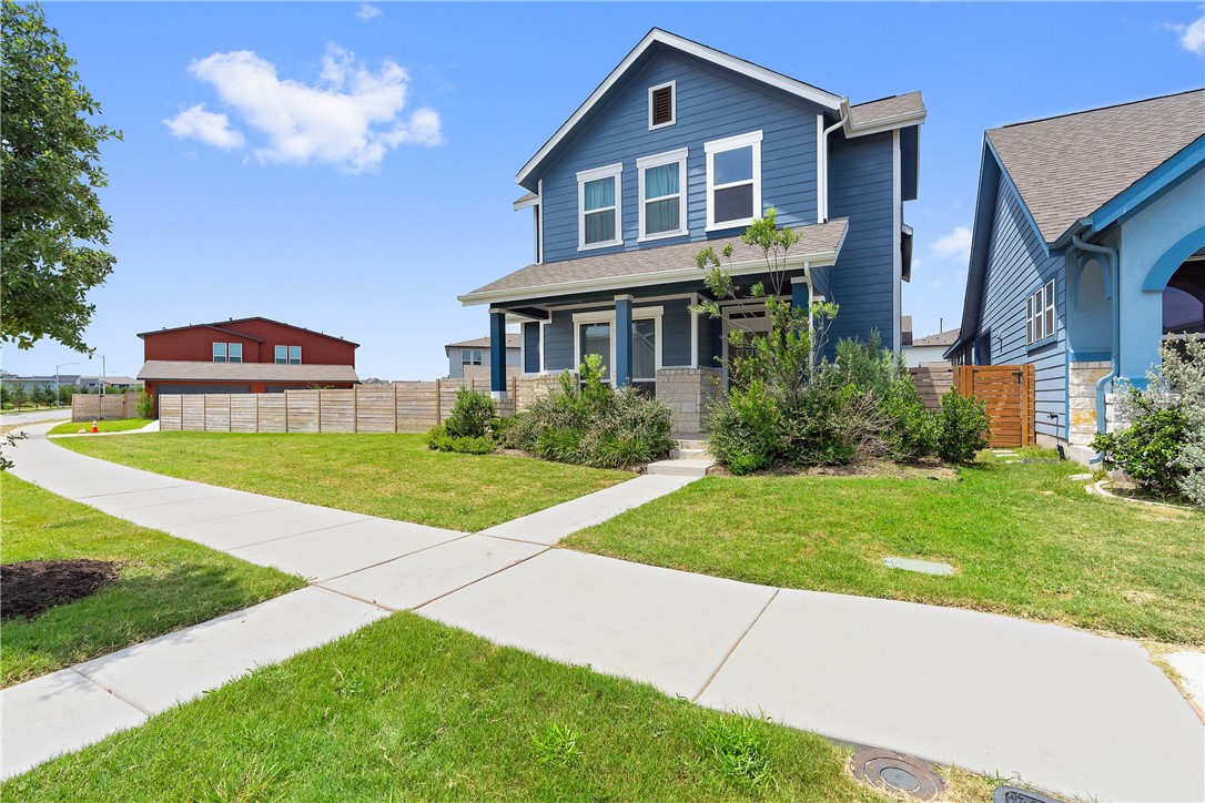 9200 Cattle Baron Path Austin, TX 78747 - Photo 1 of 1 a front view of house with yard and green space