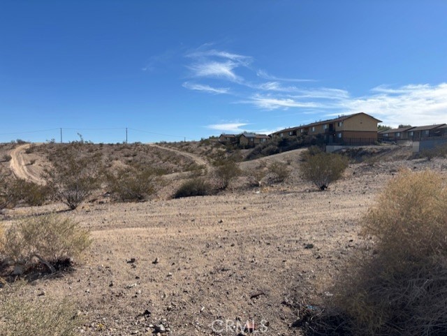 a view of ocean beach and mountain