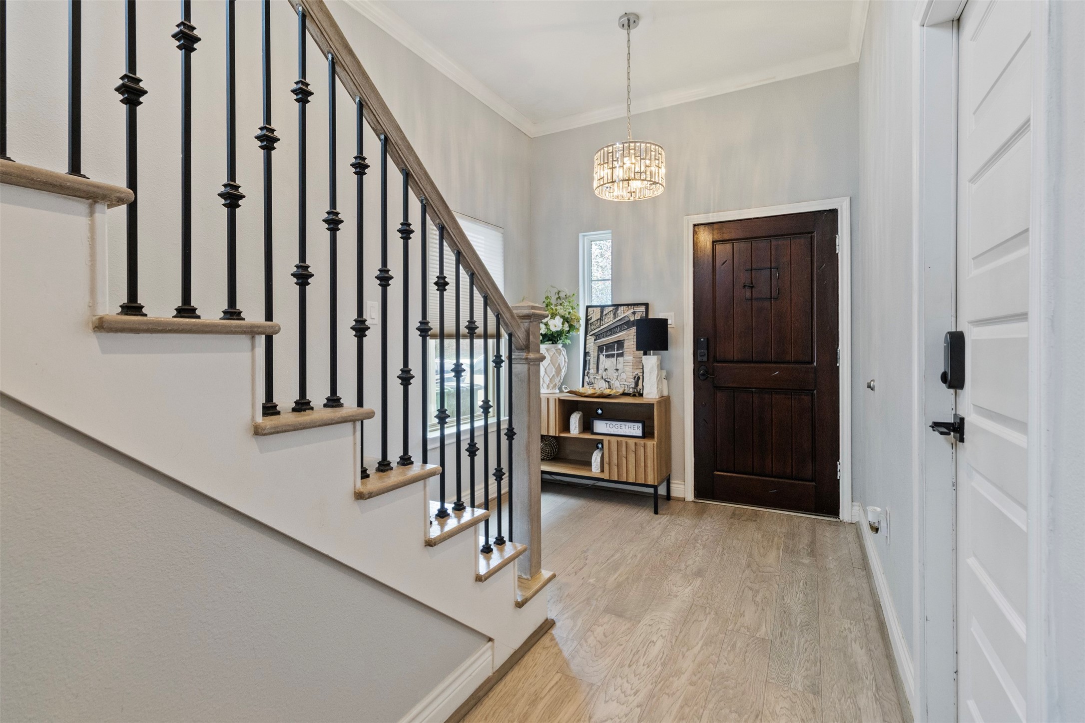 6706 Lozier Street Houston, TX 77021 - Photo 13 of 32 a view of a hallway with wooden floor and staircase