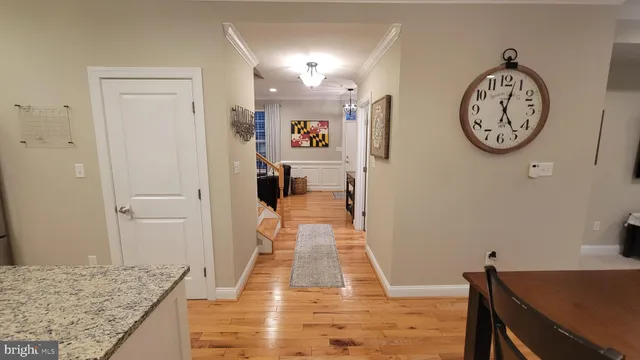 a kitchen with stainless steel appliances granite countertop a stove a sink dishwasher and a microwave oven with wooden cabinets