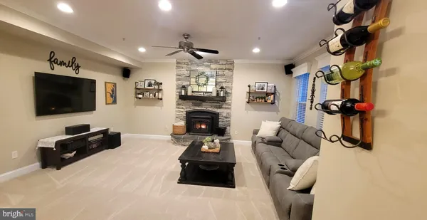 a living room with furniture and a fireplace