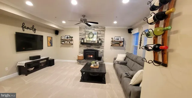 a living room with furniture and a fireplace