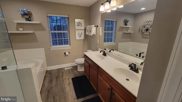 a bathroom with a tub and shower