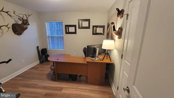 a bedroom with bed and a chandelier