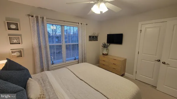 a view of staircase with white walls and a window