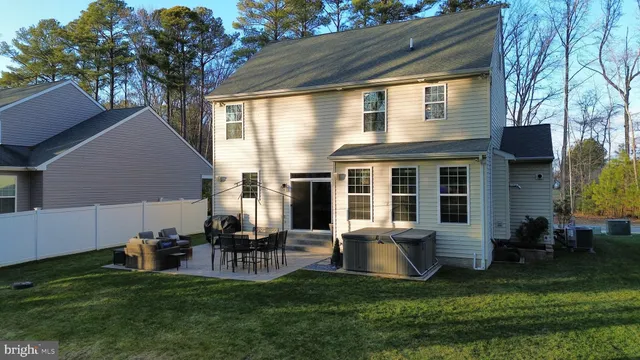 a front view of house with yard outdoor seating and barbeque oven