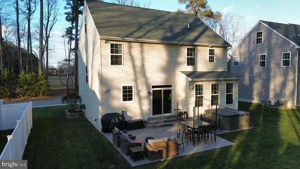 a aerial view of a house with backyard