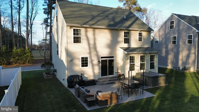 a aerial view of a house with backyard