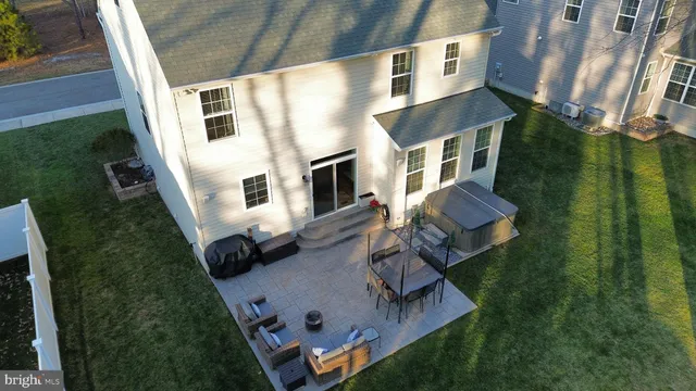 an aerial view of house with yard
