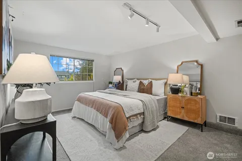 a bedroom with bed and window