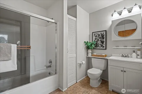 a bathroom with a toilet a sink and bathtub