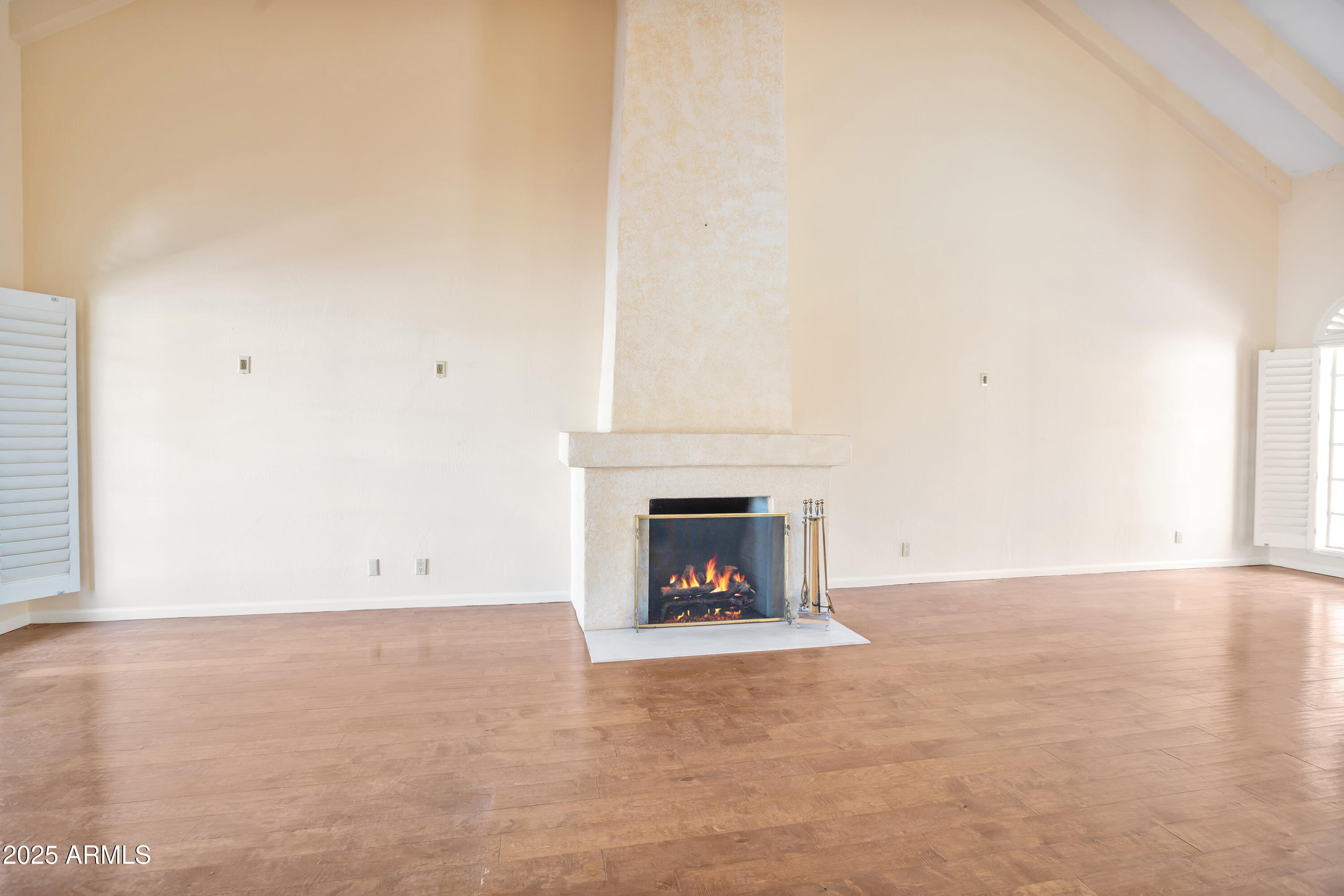6701 North Scottsdale Road, Unit 23 Scottsdale, AZ 85250 - Photo 11 of 47 a view of an empty room with a fireplace