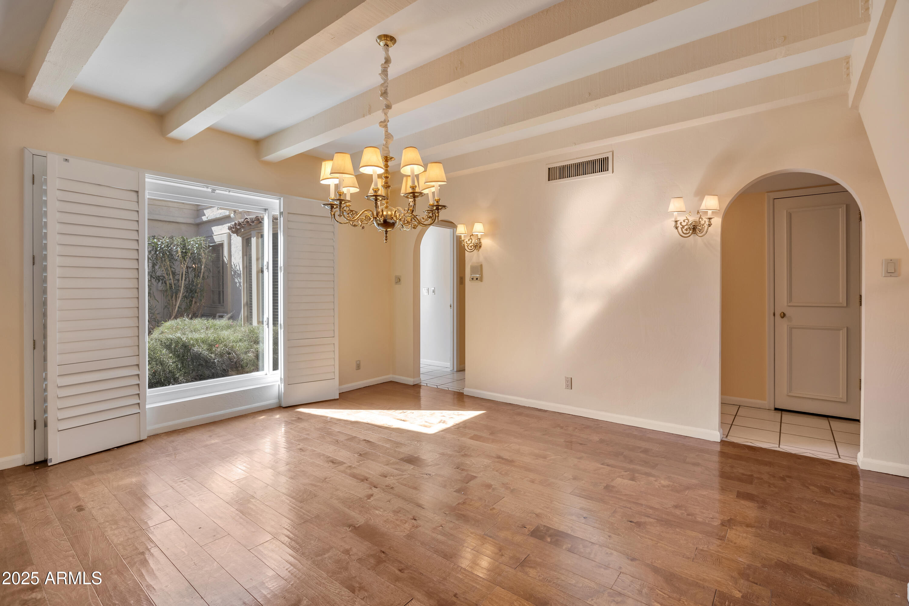 6701 North Scottsdale Road, Unit 23 Scottsdale, AZ 85250 - Photo 13 of 47 a view of a livingroom with a chandelier swimming pool and windows