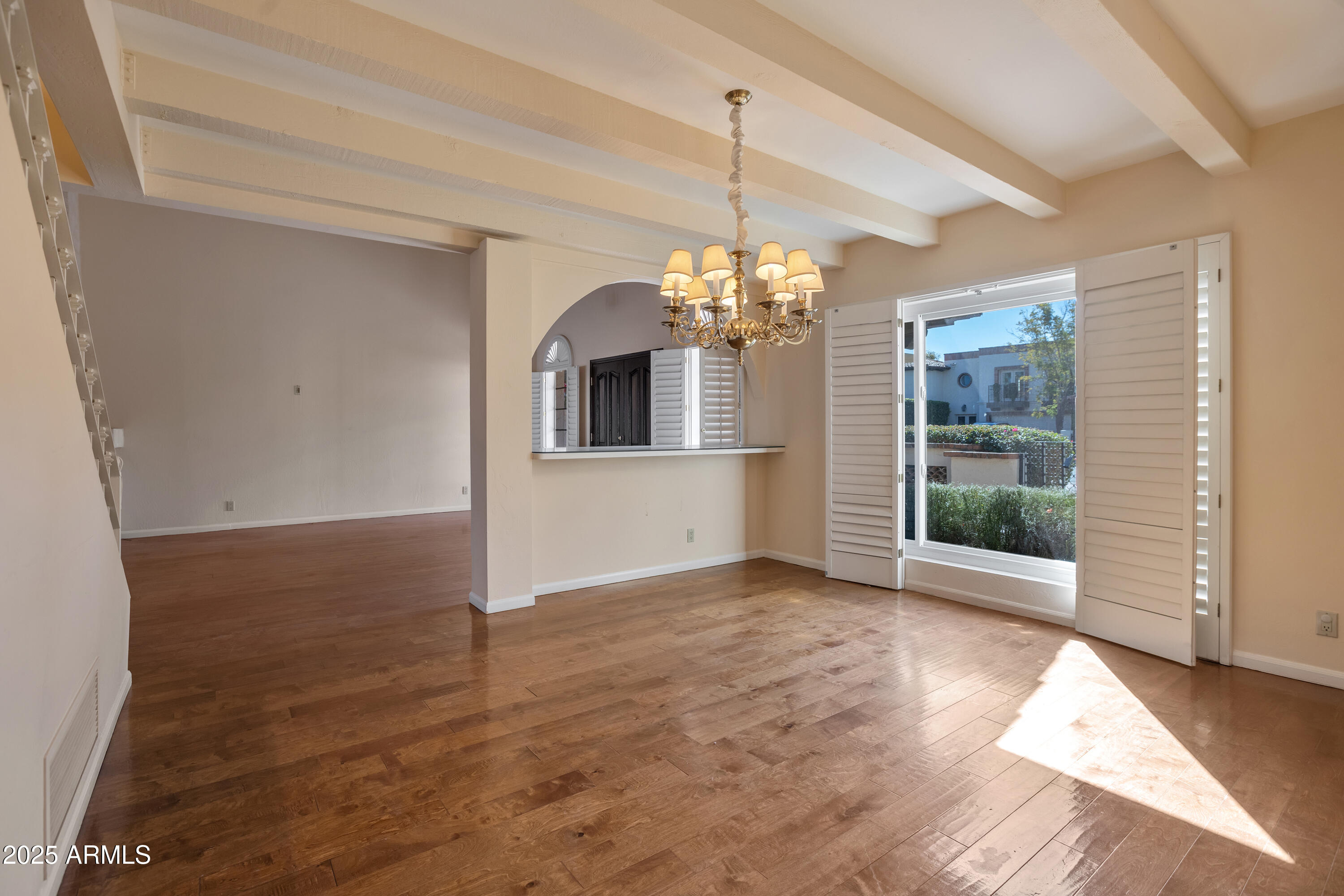 6701 North Scottsdale Road, Unit 23 Scottsdale, AZ 85250 - Photo 14 of 47 wooden floor in an empty room with a window