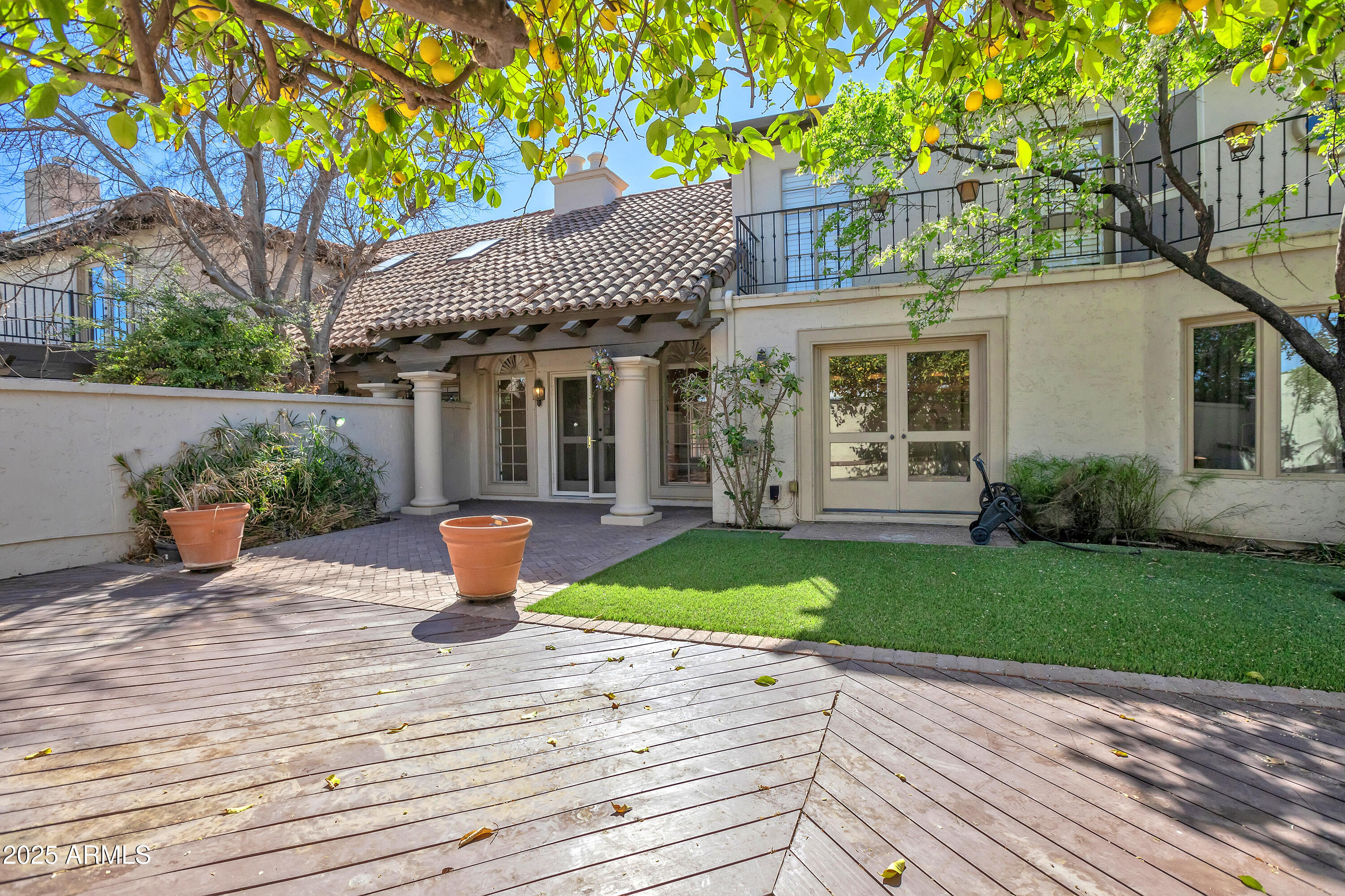 6701 North Scottsdale Road, Unit 23 Scottsdale, AZ 85250 - Photo 17 of 47 a front view of a house with garden