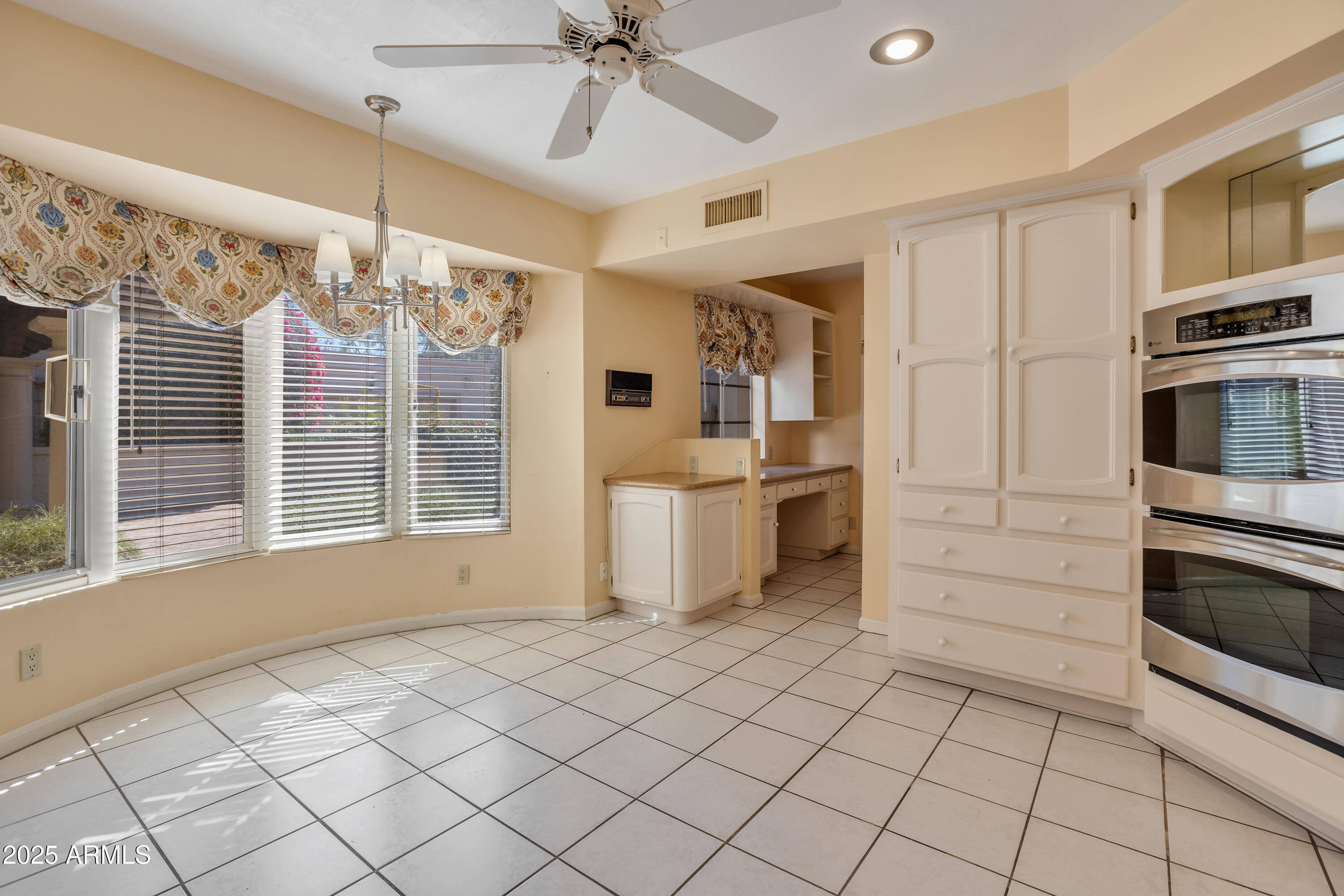 6701 North Scottsdale Road, Unit 23 Scottsdale, AZ 85250 - Photo 20 of 47 a view of a kitchen with furniture and windows