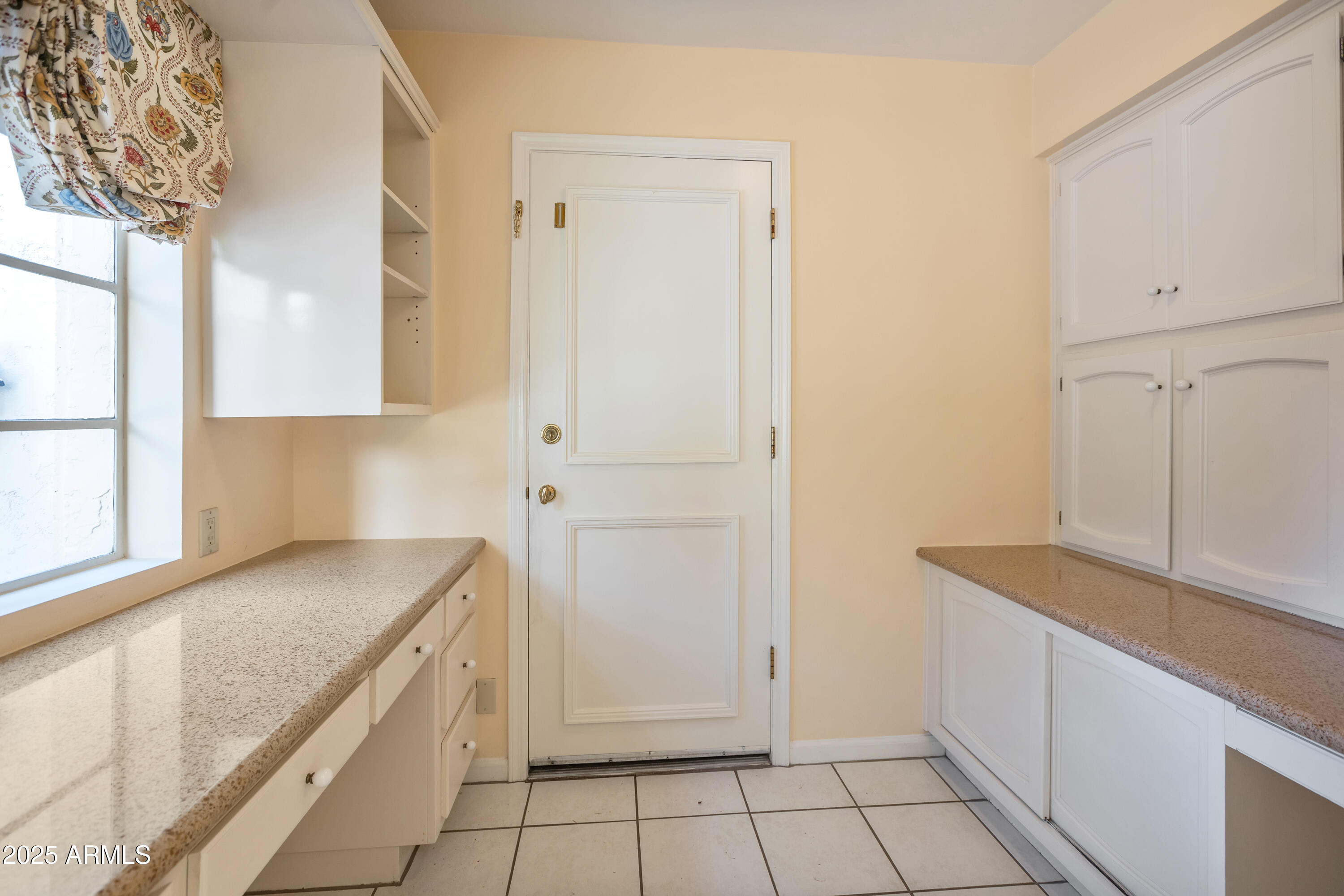 6701 North Scottsdale Road, Unit 23 Scottsdale, AZ 85250 - Photo 24 of 47 a view of a kitchen with white cabinets